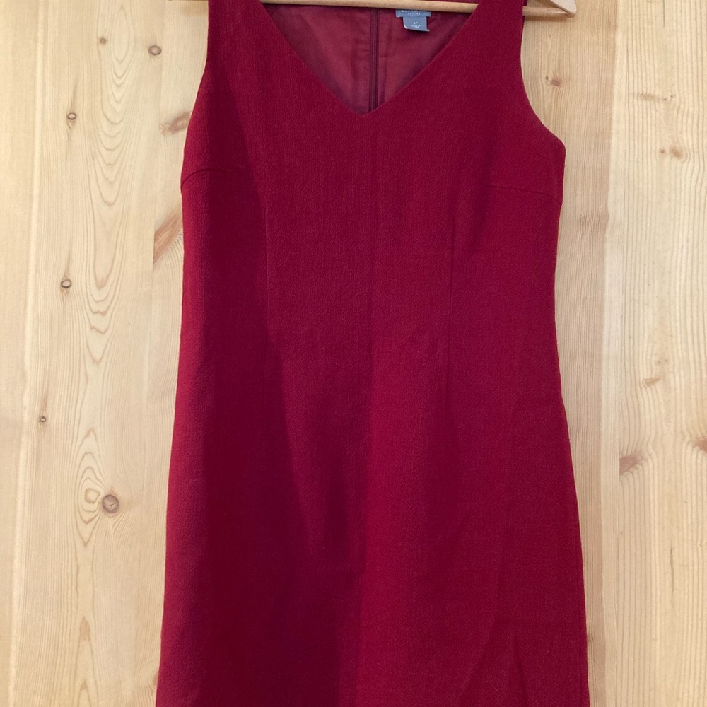 100% virgin wool lined dress with a V neck and back zipper